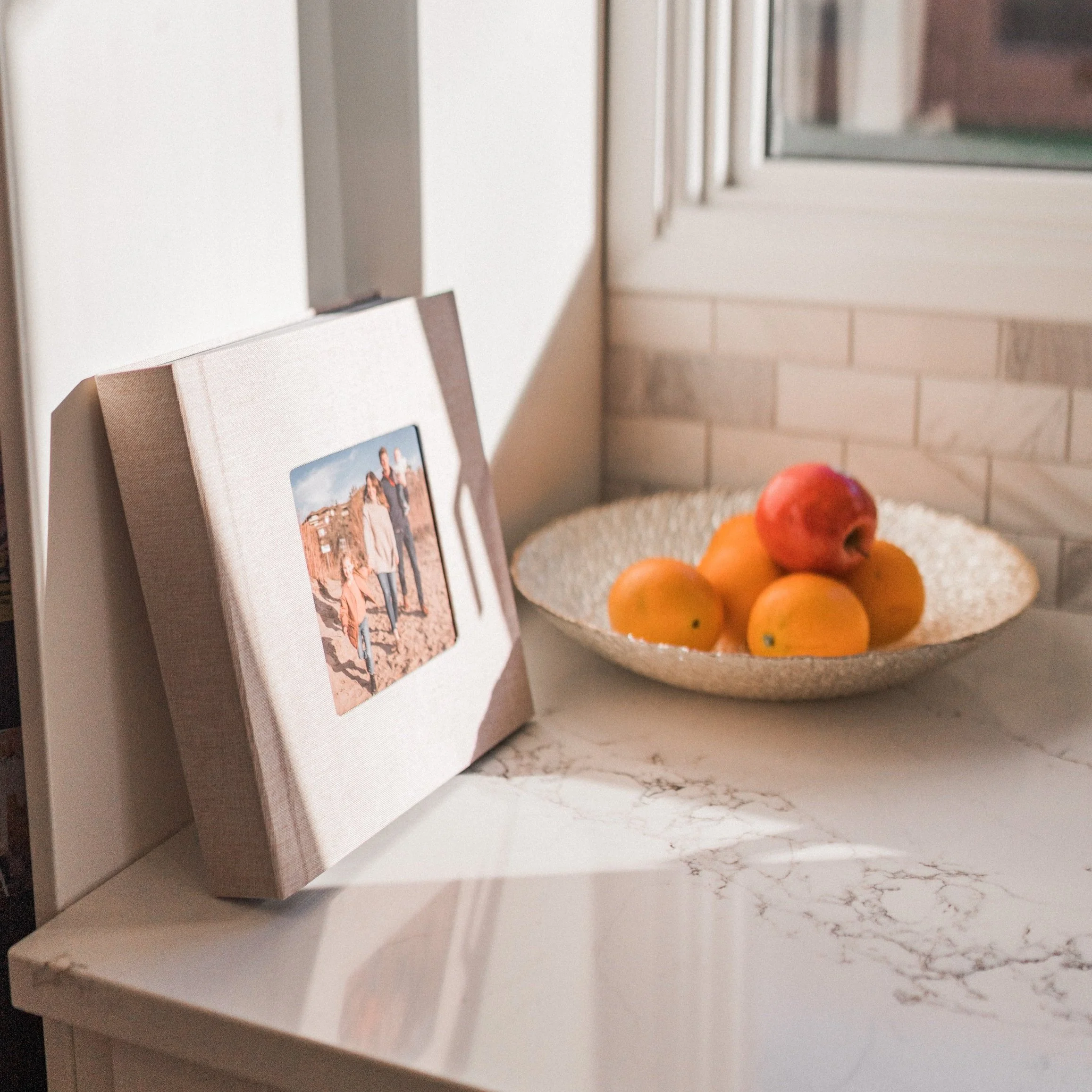 A 10x10 layflat wedding album with a linen cover